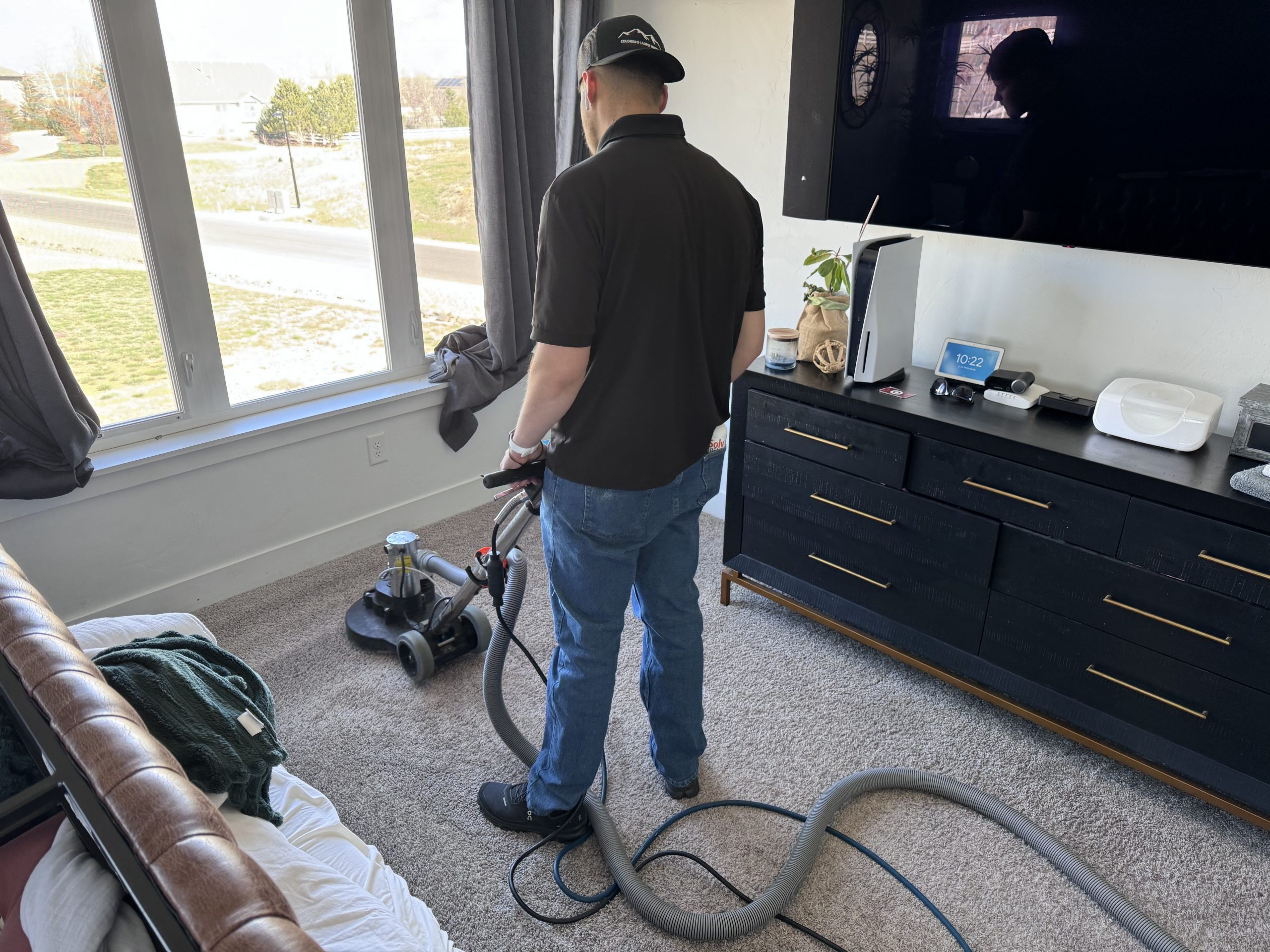 Colorado Carpet Masters IICRC certified technician Grant Wroblewski is aggressively cleaning the carpet fibers from all directions