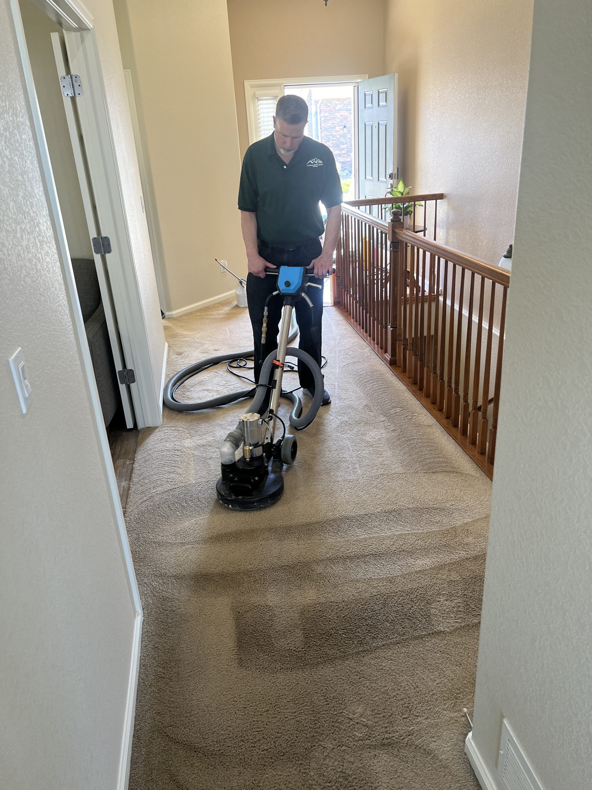 Colorado Carpet Masters 303 459 2482 Keith Wroblewski is cleaning carpets in Brighton CO with t rex power wand showing why they are best carpet cleaning company in brighton co.