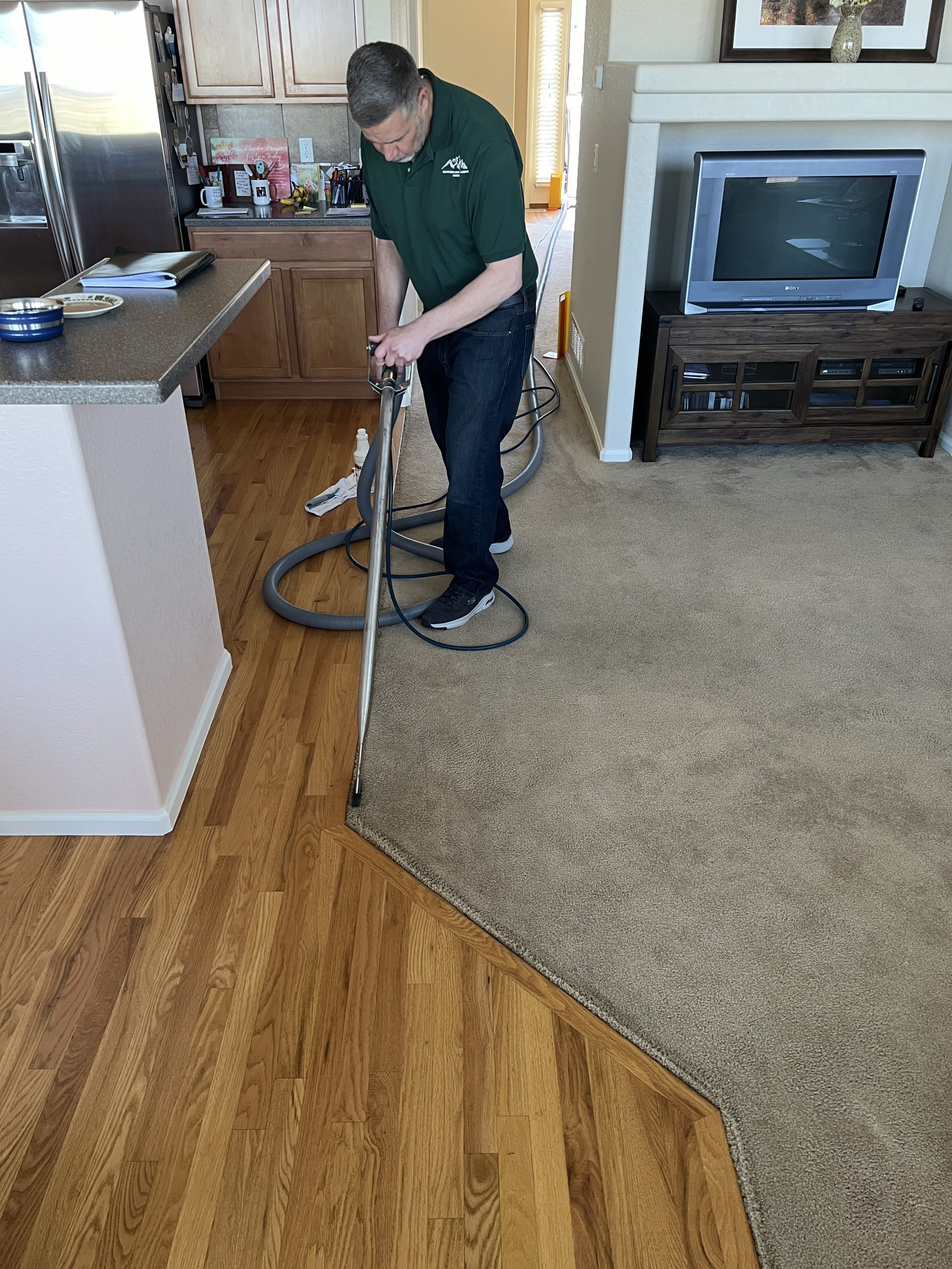 Colorado Carpet Masters owner carefully carpet cleaning soil filtration edges in Commerce City CO.